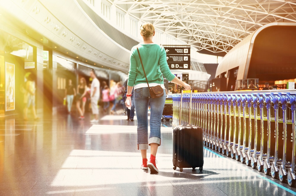 woman in airport traveling to Costa Rica