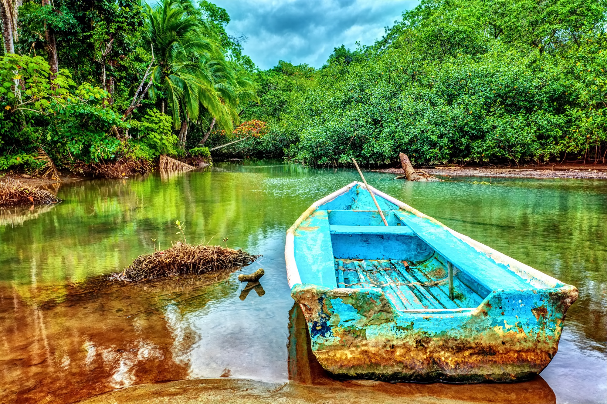 Old boat in tropical river in Costa Rica